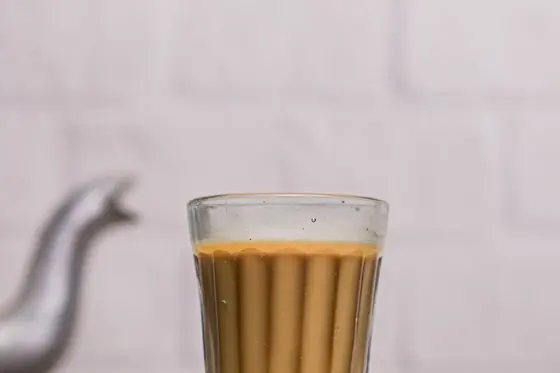 Masala chai with kettle and spices